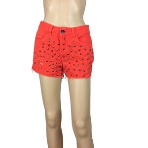 Distressed red studded highwaist shorts